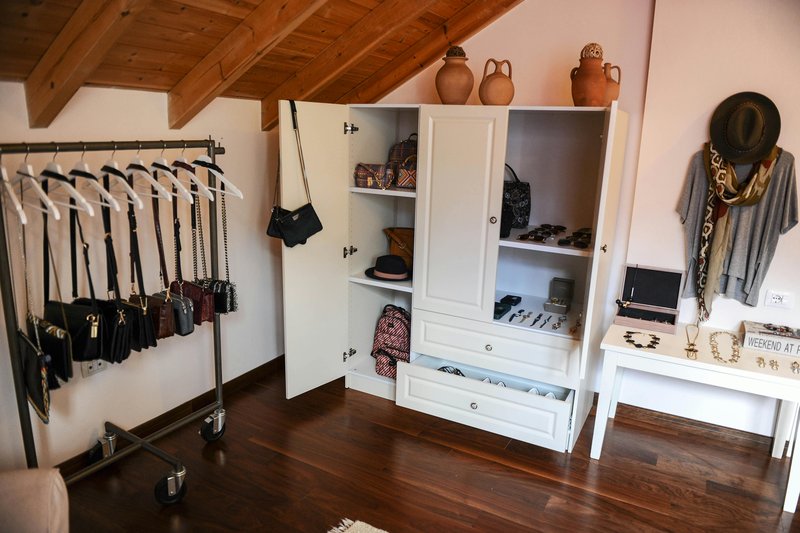 boho chic walk in closet wicker rattan earth tones — practical organization ideas