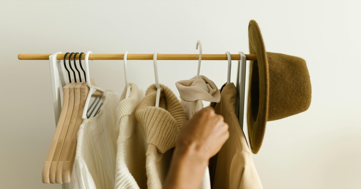 Aromatic cedar blocks arranged on a closet shelf next to folded wool sweaters for moth protection